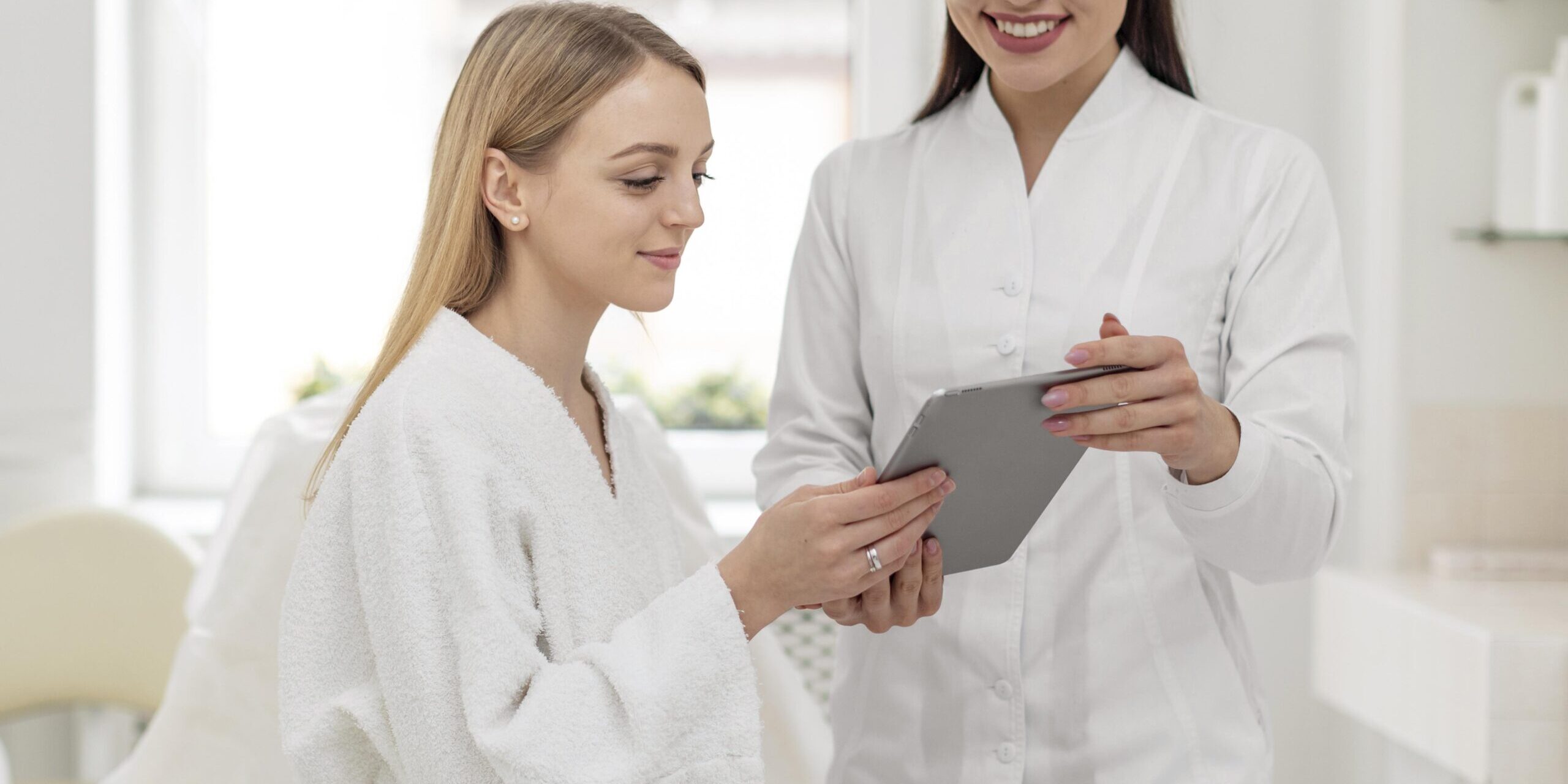 beautician-woman-at-clinic-consults-client